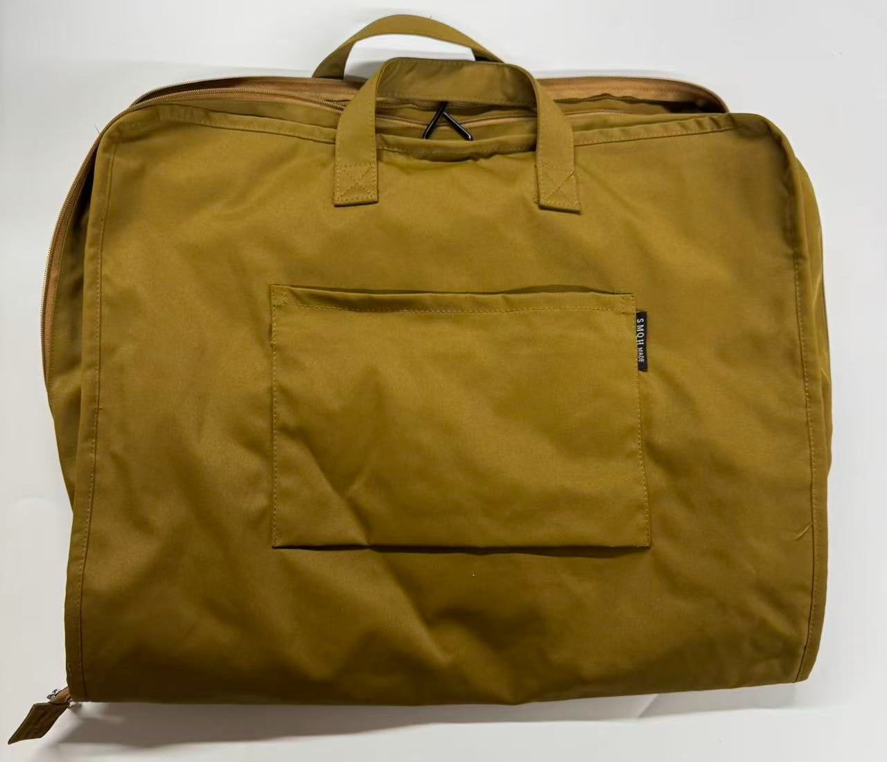 Mustard travel bag sample with top zipper handles and front pocket