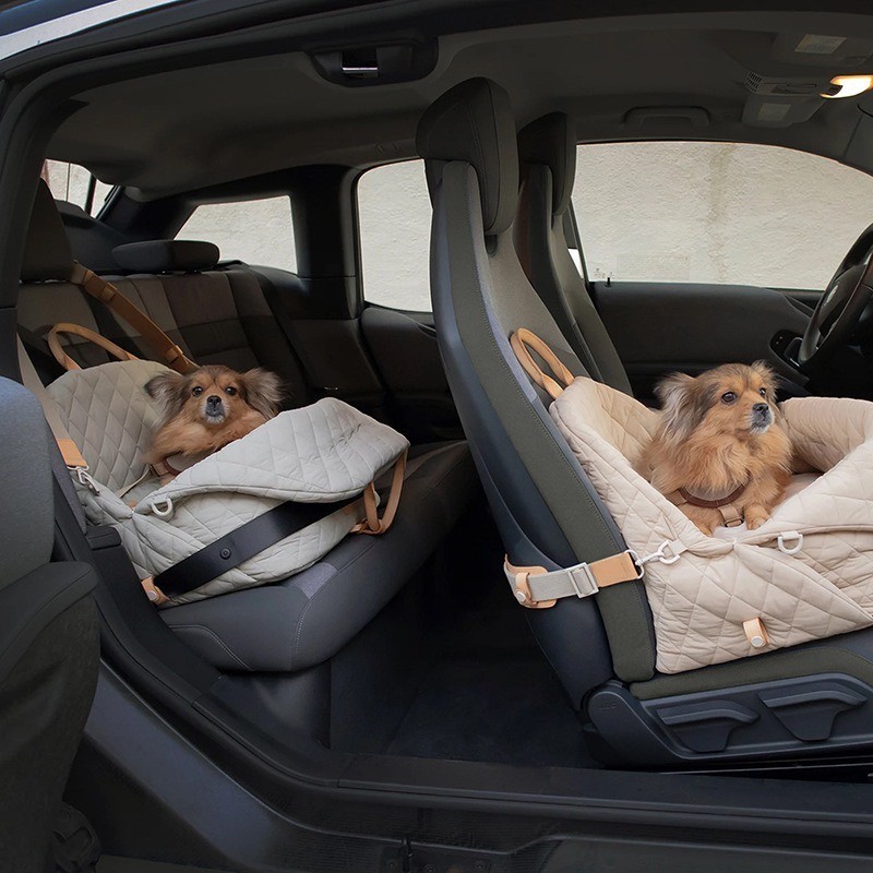 quilted pet car seat carrier shown on a front and rear vehicle seat