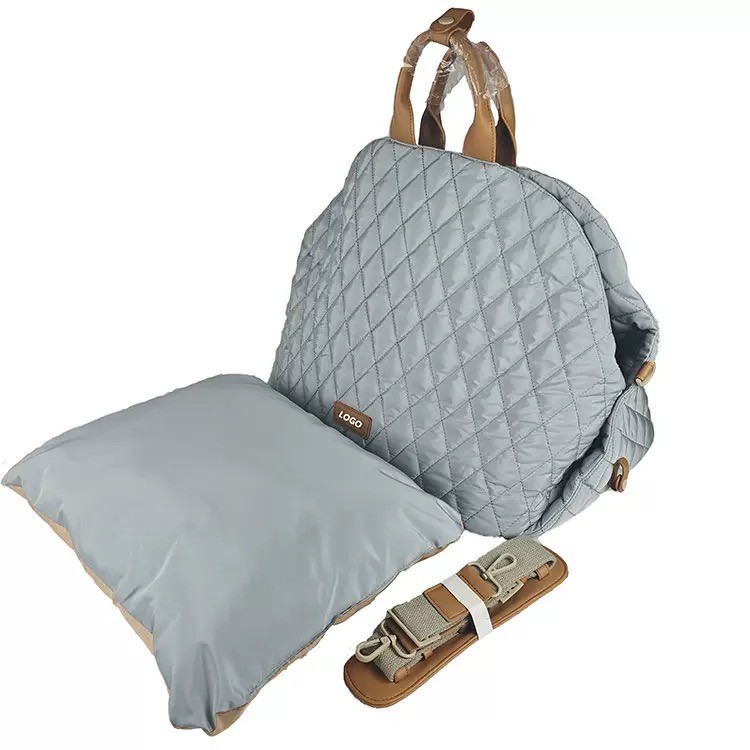 inner cushion and shoulder strap on a quilted pet car seat carrier