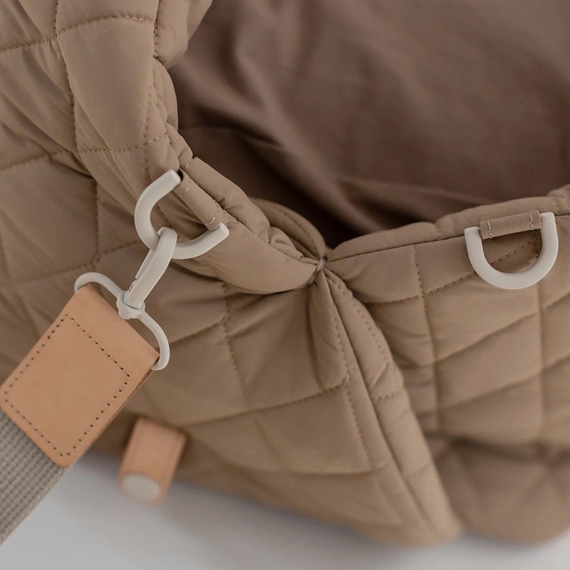 adjustable webbing and side hardware on quilted pet car seat carrier